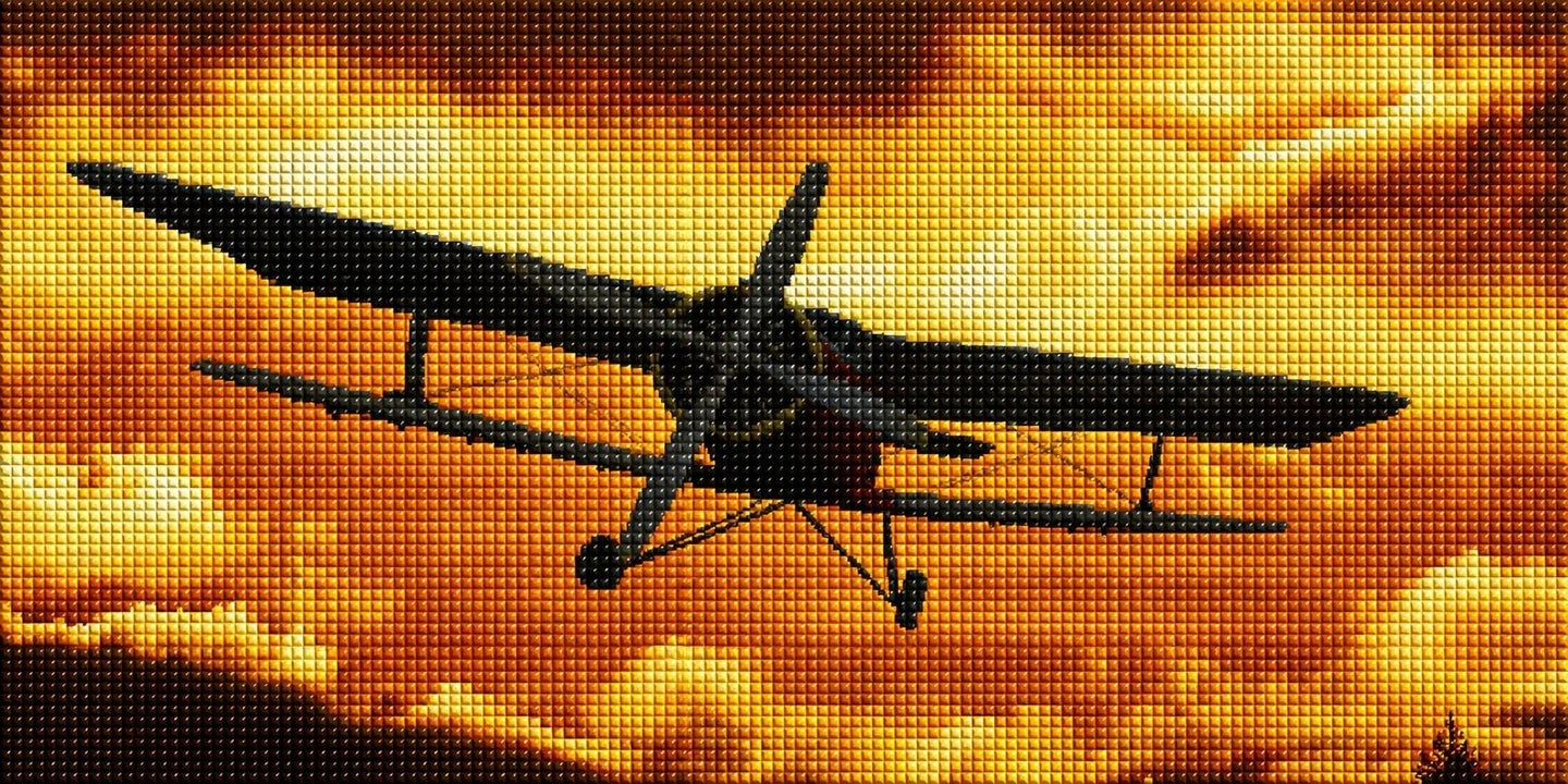 Diamond Painting mit Doppeldecker als Silhouette vor goldorange leuchtendem Wolkenhimmel. Mockup.