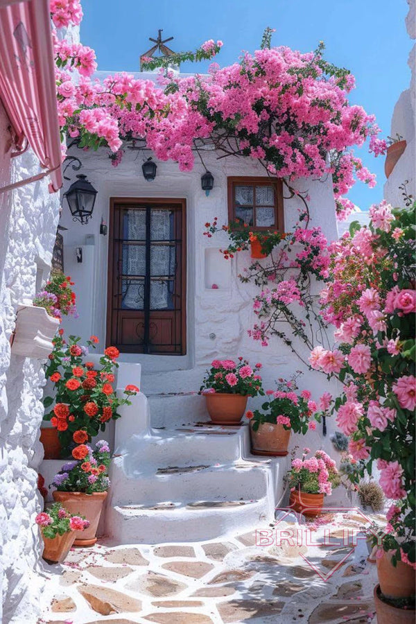 Diamond Painting Architektur Weißes griechisches Haus mit pinken Blumen und Treppe