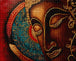 Diamond Painting mit stilisiertem Buddha-Gesicht in warmen Braun- und Goldtönen mit türkisen Ornamenten. Mockup.