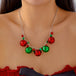 Silberne Halskette mit unterschiedlichen weihnachtlichen Charms und bunten festlichen Gloeckchen