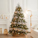 Kuenstlicher Weihnachtsbaum mit rosa-goldenem Weihnachtsschmuck, Schleifen und festlicher Beleuchtung