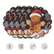 vierteiliges Weihnachts Tischset mit Lebkuchenmann, Zuckerstangen und Schneeflocken auf schwarzem Hintergrund