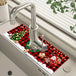 Auswahl verschiedener saugfähiger Weihnachtsmatten für den Wasserhahn mit Weihnachtsmann, Tannenbaum und Wintermotiven