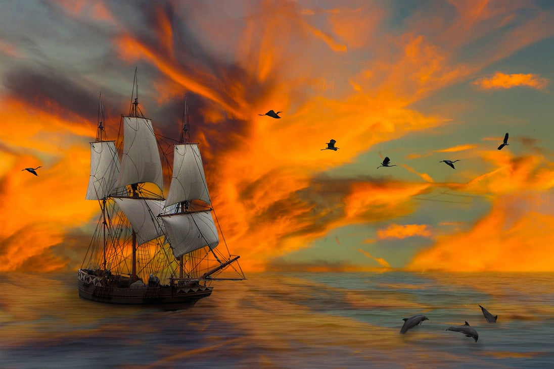 Diamond Painting eines Segelschiffs auf dem Meer bei Sonnenuntergang mit springenden Delfinen und Vögeln. 
