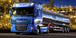 Diamond Painting mit blauem DAF Tanklastzug vor beleuchteter Industrieanlage bei Nacht.
