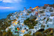 Diamond Painting mit Santorini, weißen Häusern und Abendbeleuchtung an der Steilküste.
