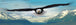 Diamond Painting eines fliegenden Weißkopfseeadlers über einem weiten Panorama aus verschneiten Berggipfeln. 

