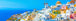 Diamond Painting Panorama der weißen Häuser von Santorini mit blauen Kuppeln am Meer unter blauem Himmel.
